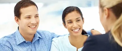 Couple talking to mortgage advisor