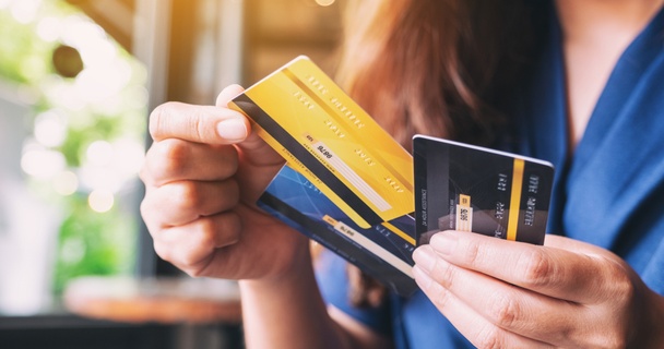 woman holding credit cards