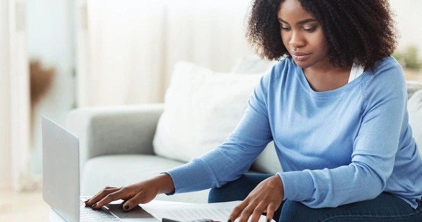 Woman doing finances at her laptop