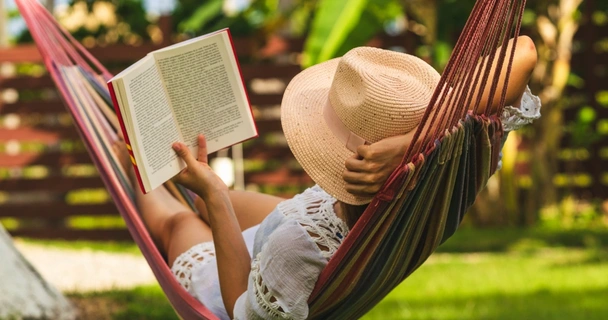 woman reading in a hammock