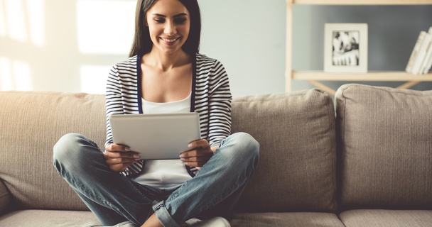 woman looking at tablet