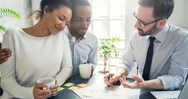 Couple at the bank speaking with an advisor