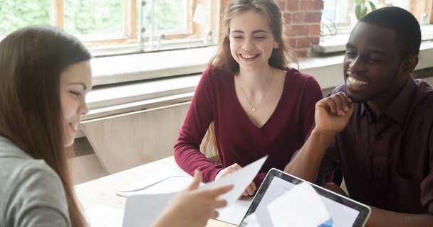 couple talking to a lender at a desk