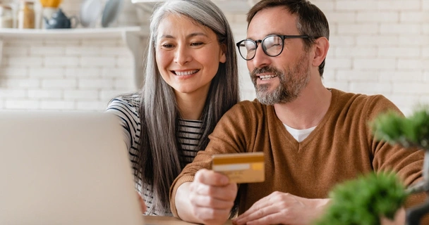 Couple looking at a laptop