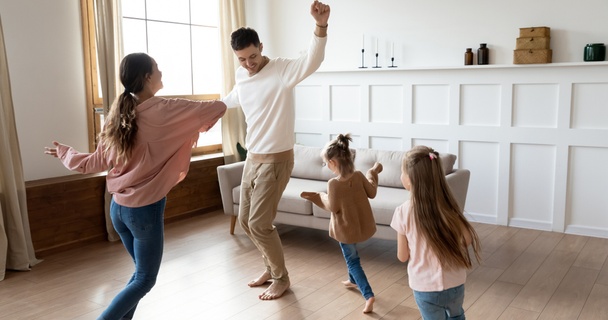 family celebrating new home in lounge