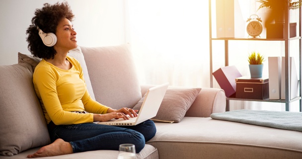 Woman on sofa with laptop