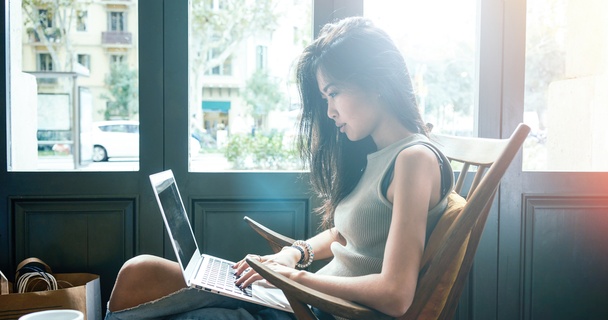woman on laptop in coffee shop
