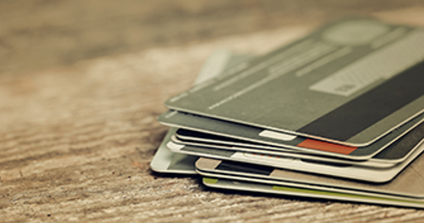 a stack of credit cards on a table