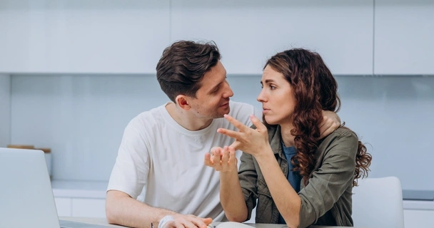 couple having a conversation at a table