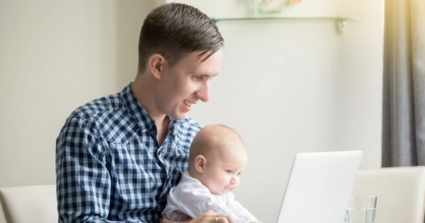 Father and child at computer