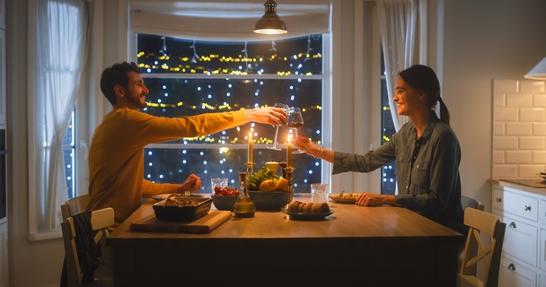 couple enjoying a romantic date night dinner at home