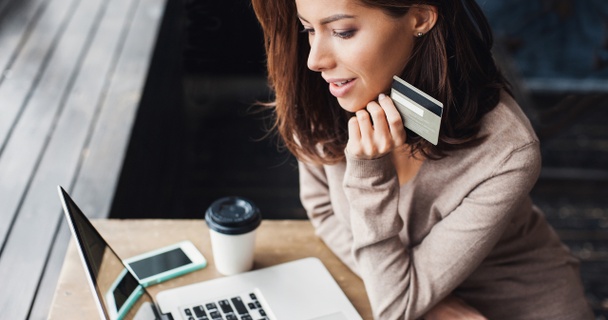 Woman shopping online with her credit card