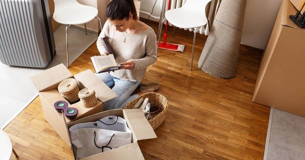 Person packing away possessions