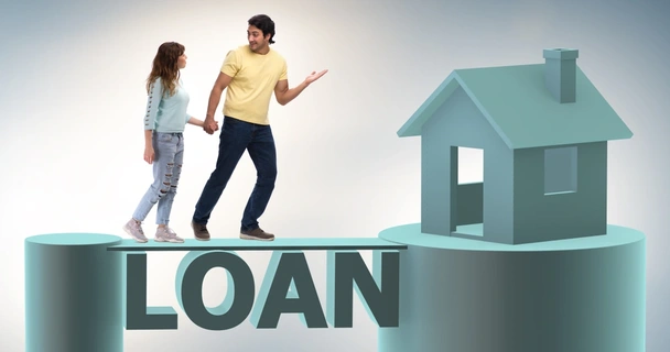 Couple standing on a CGI bridge written with the word loan which leads to a house.