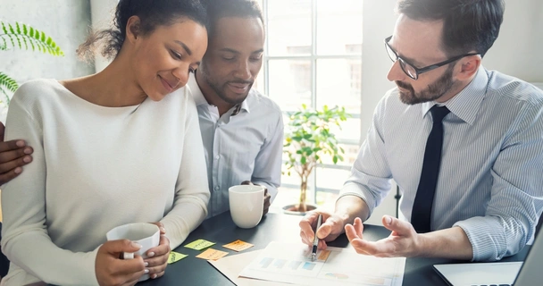 Couple at the bank speaking with an advisor