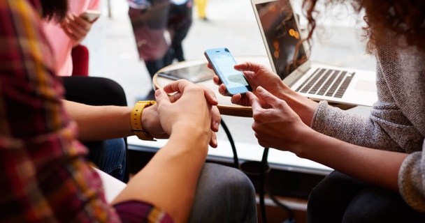 People looking at a mobile phone