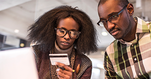Couple looking at a credit card