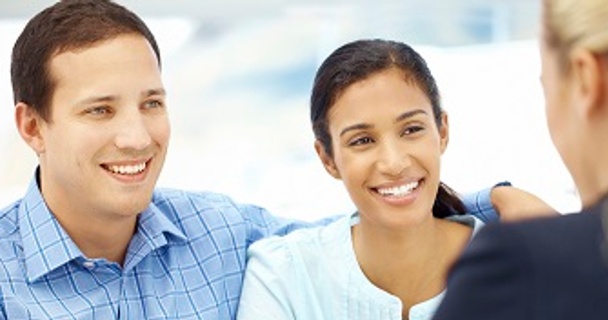 Couple talking to mortgage advisor