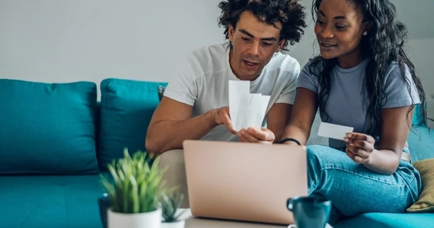 Young couple looking through accounts together