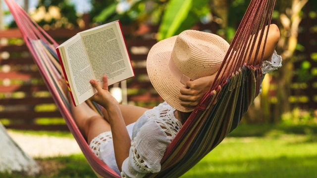 woman reading in a hammock