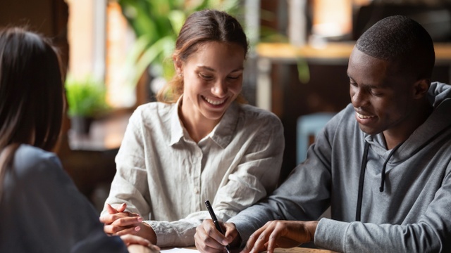 couple signing mortgage