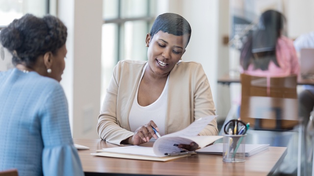 Lady speaking to a mortgage advisor