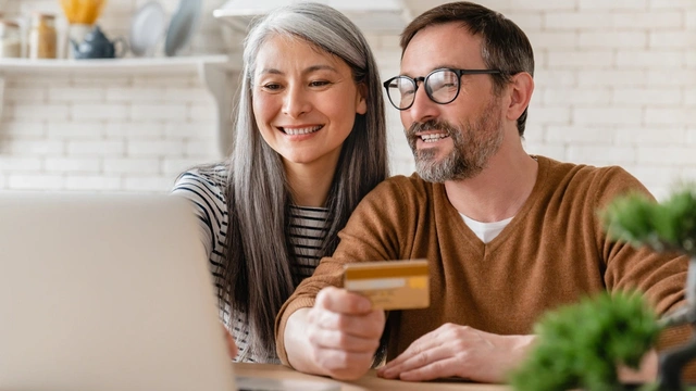 Couple looking at a laptop