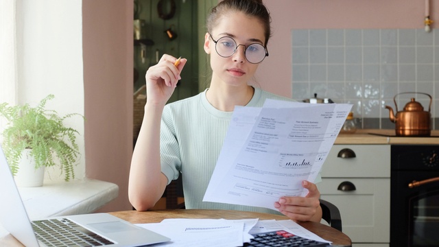 Woman checking energy bills