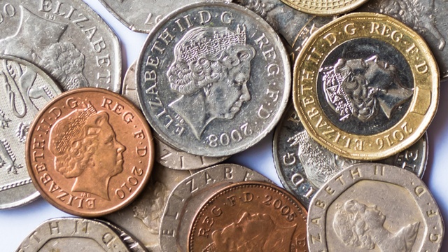 selection of British coins featuring the Queen's face