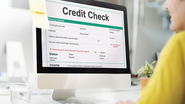 Someone at computer checking their credit file
