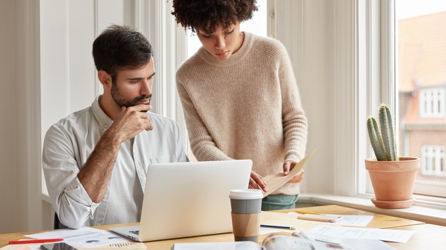Couple using laptop