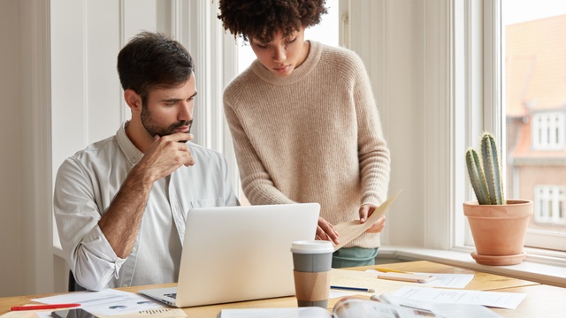 couple using laptop