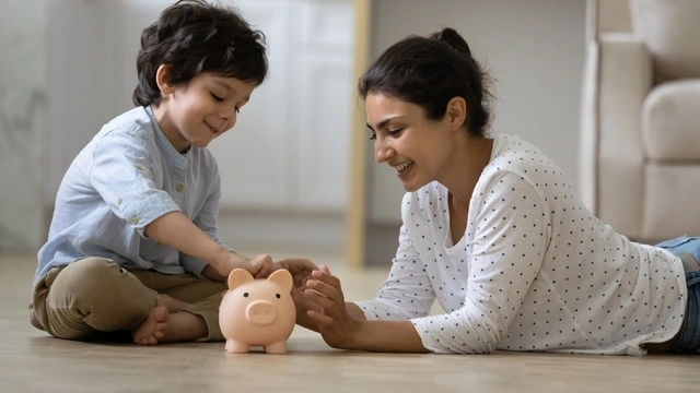 Parent and child with piggy bank