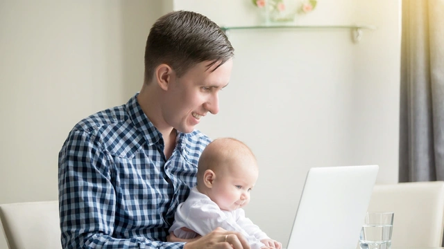 Father and child at computer