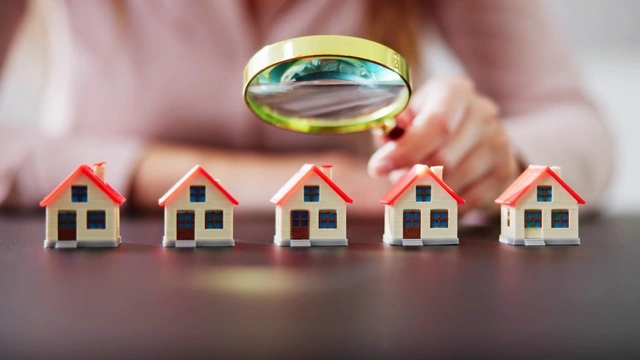 Drawing of houses with a magnifying glass over them