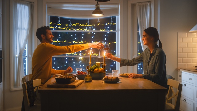 couple enjoying a romantic date night dinner at home