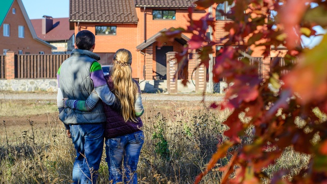 Couple looking at their home