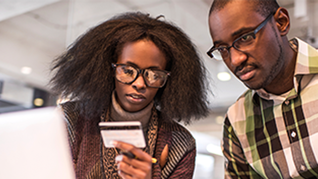 Couple looking at a credit card