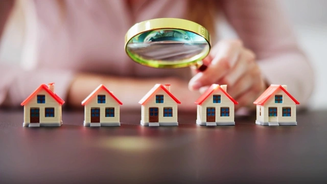 Drawing of houses with a magnifying glass over them