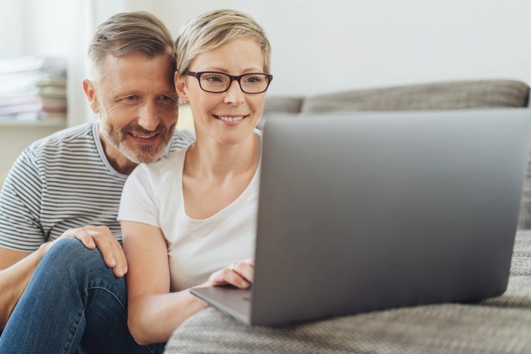 Couple looking at loans online