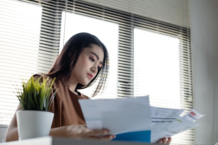 Woman looking over paperwork