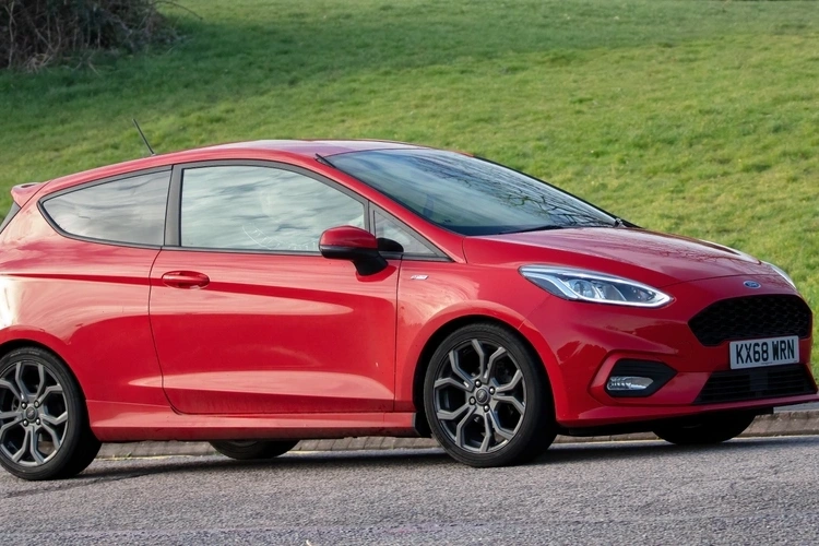 Red Ford Fiesta parked up