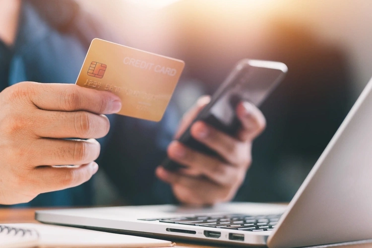 Close up Male hands holding credit card and smartphone