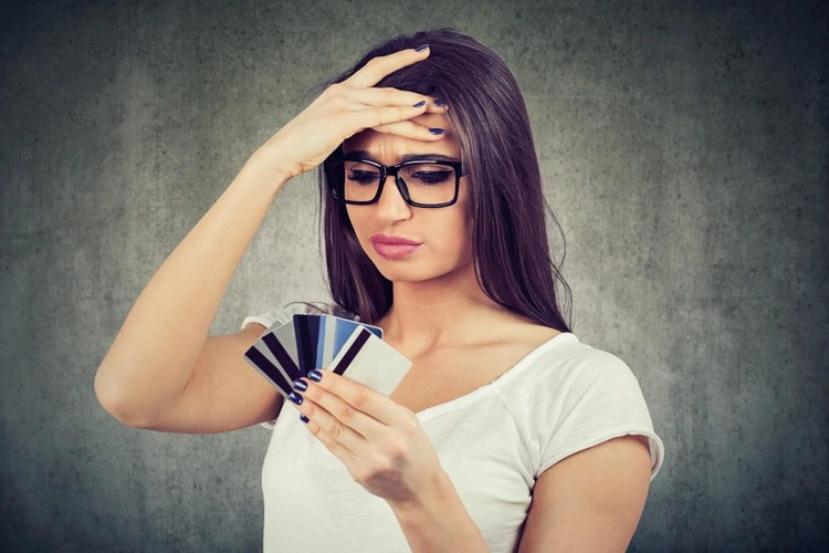 Woman with multiple credit cards in her hand