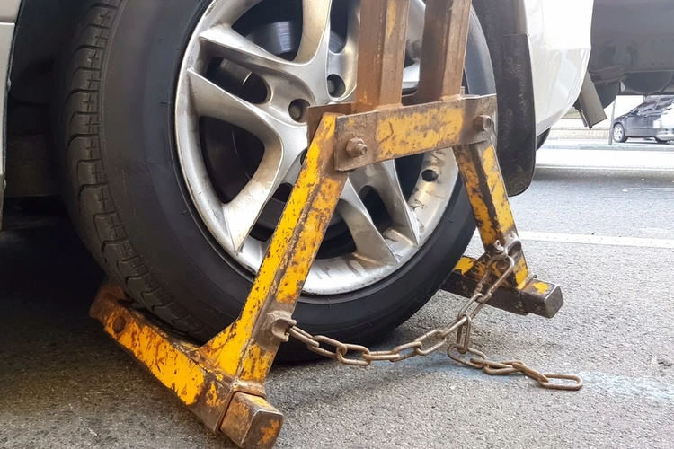 Car with wheel clamped