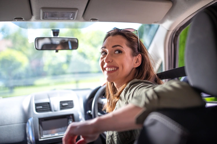 smiling woman in driving seat