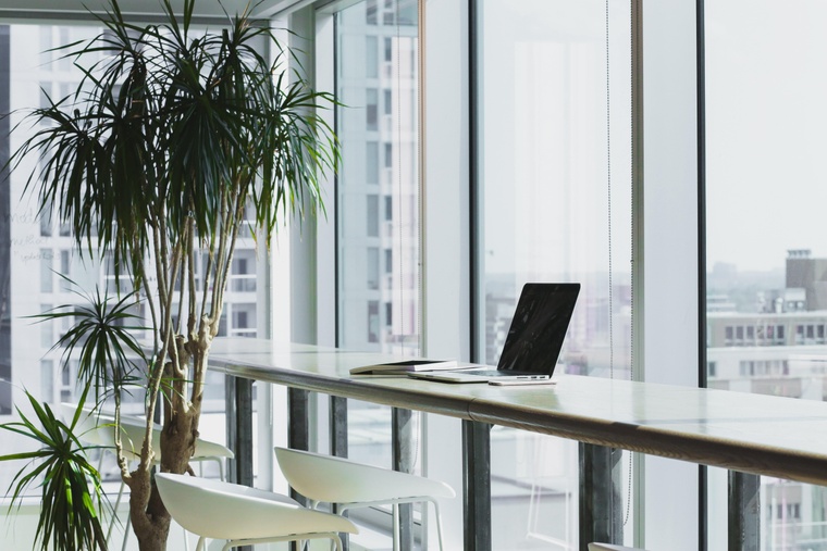 Laptop on desk empty office