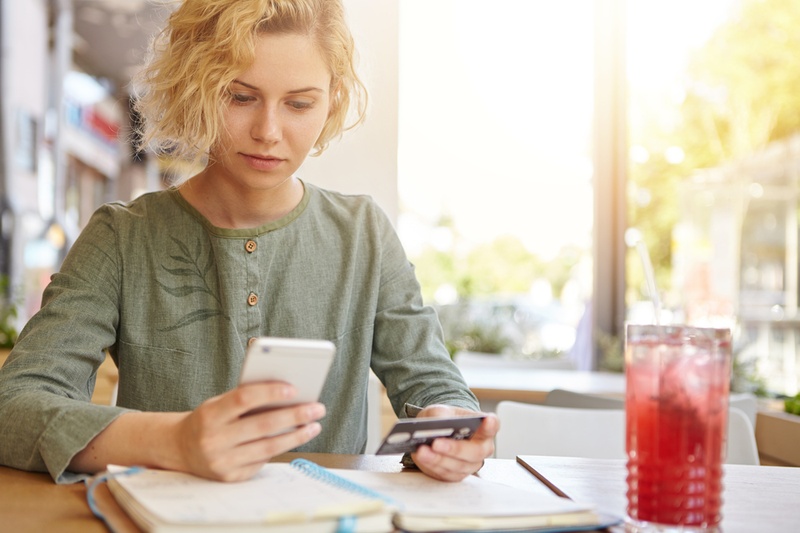 Woman on phone with credit card