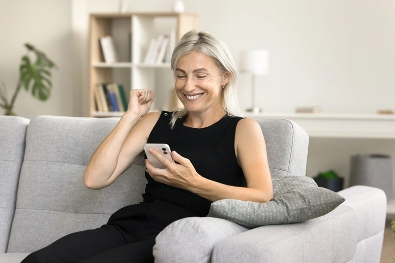 Woman looking at loan offers on her smartphone