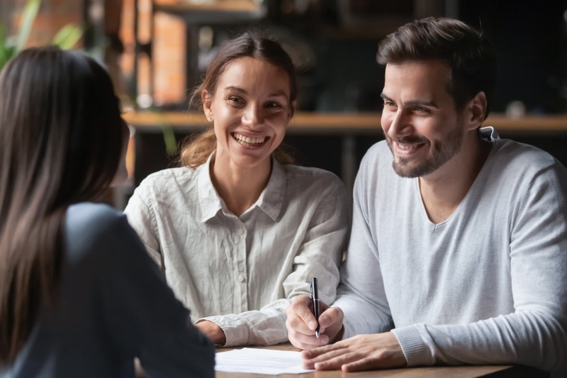 Couple talking to a finance broker
